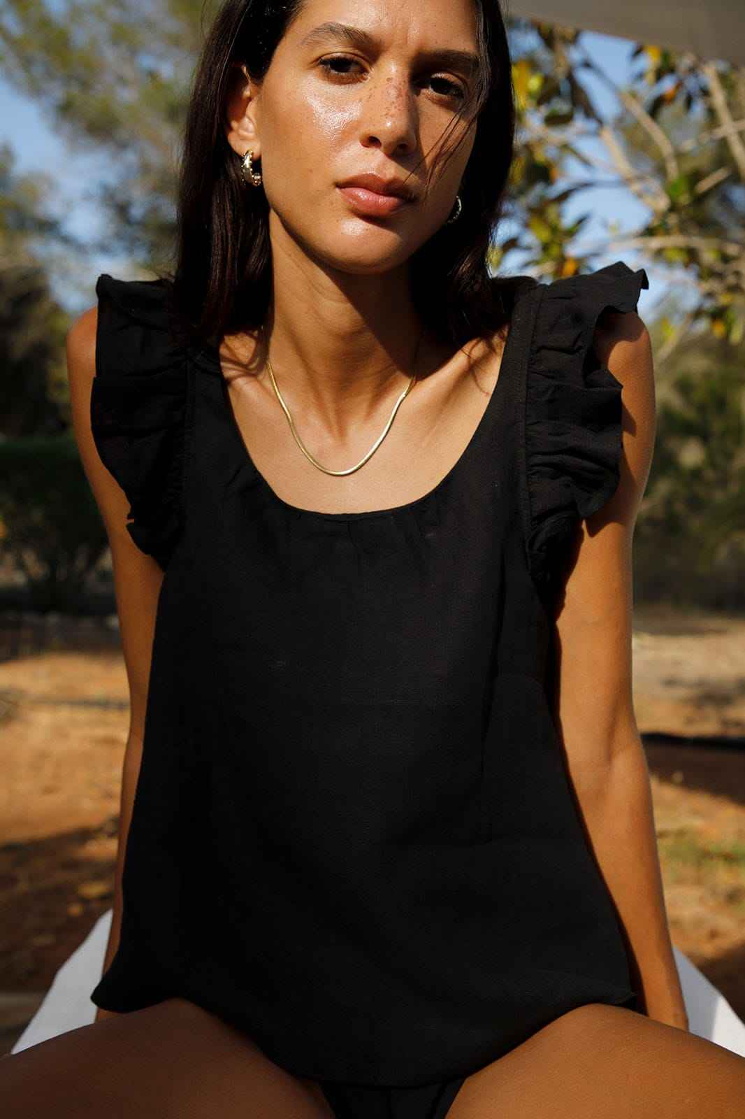 The Jeanne Ruffled Top in black