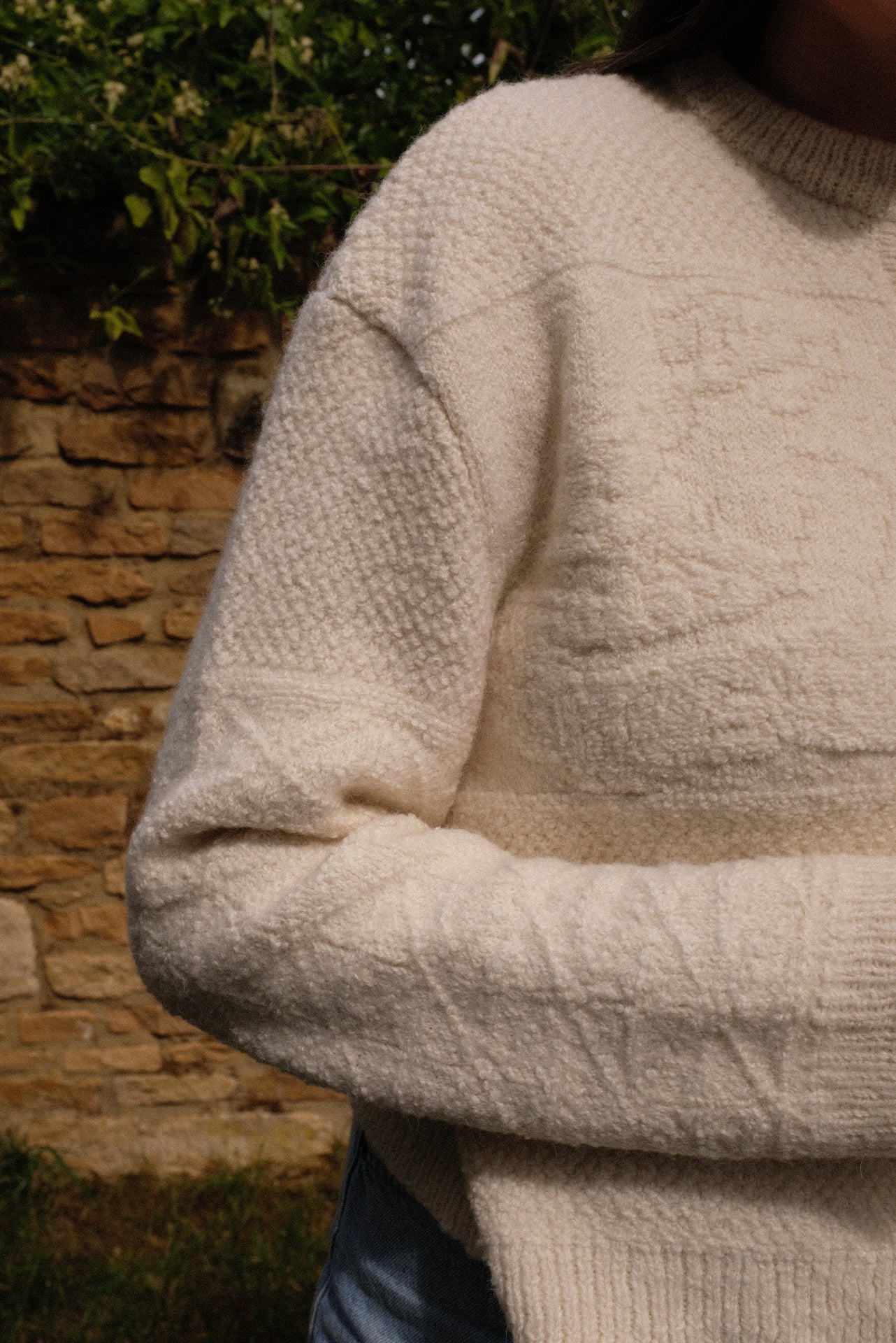 Athena Cardigan in ivory alpaca showcasing textured details, embodying sustainable knitwear cardigan style.