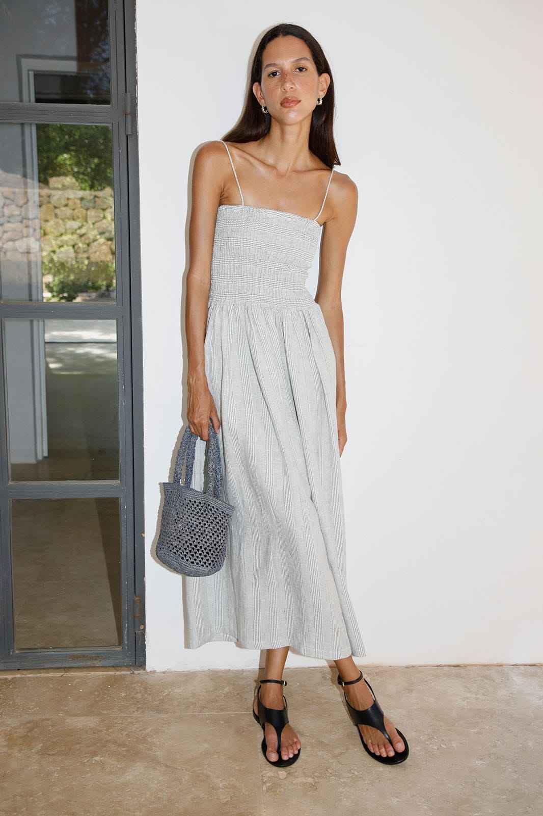The Harlow Smocked Maxi Dress in striped olive green