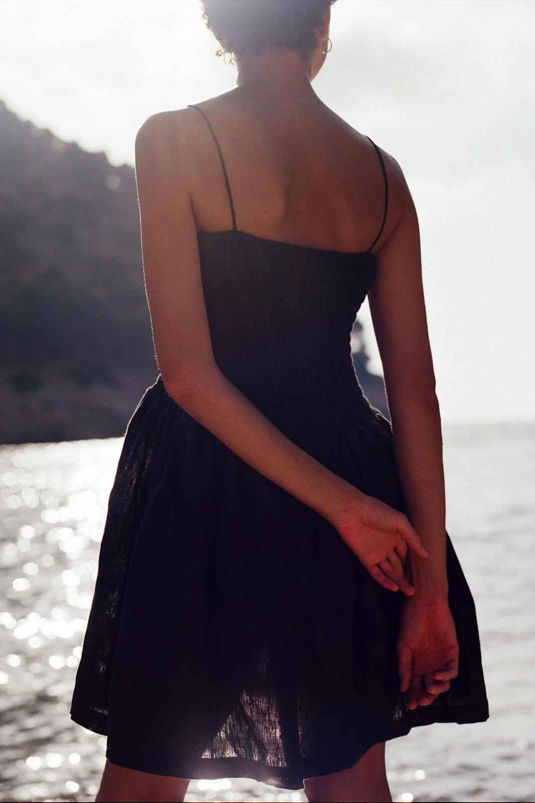 The Harlow Smocked Mini Dress in black