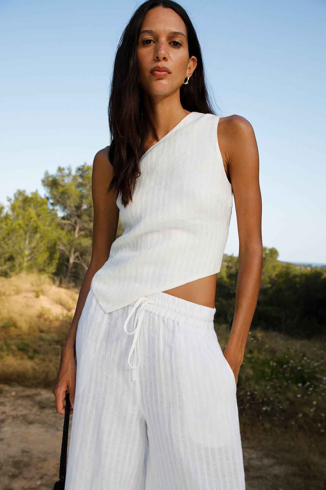 The Ava Asymmetric One-Shoulder Top in off-white